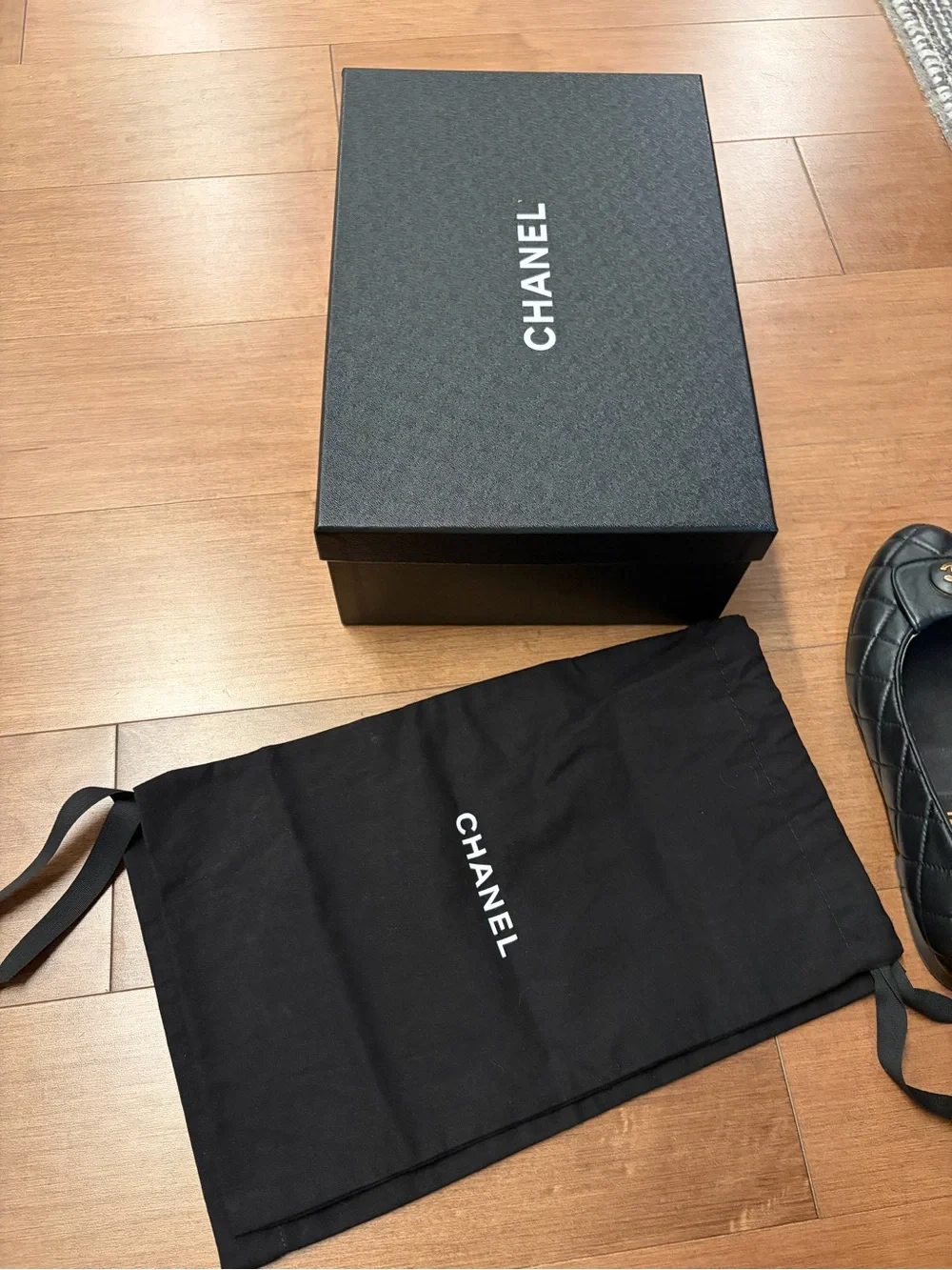 CHANEL Black Quilted Leather Ballet Flats with Gold CC Plaque